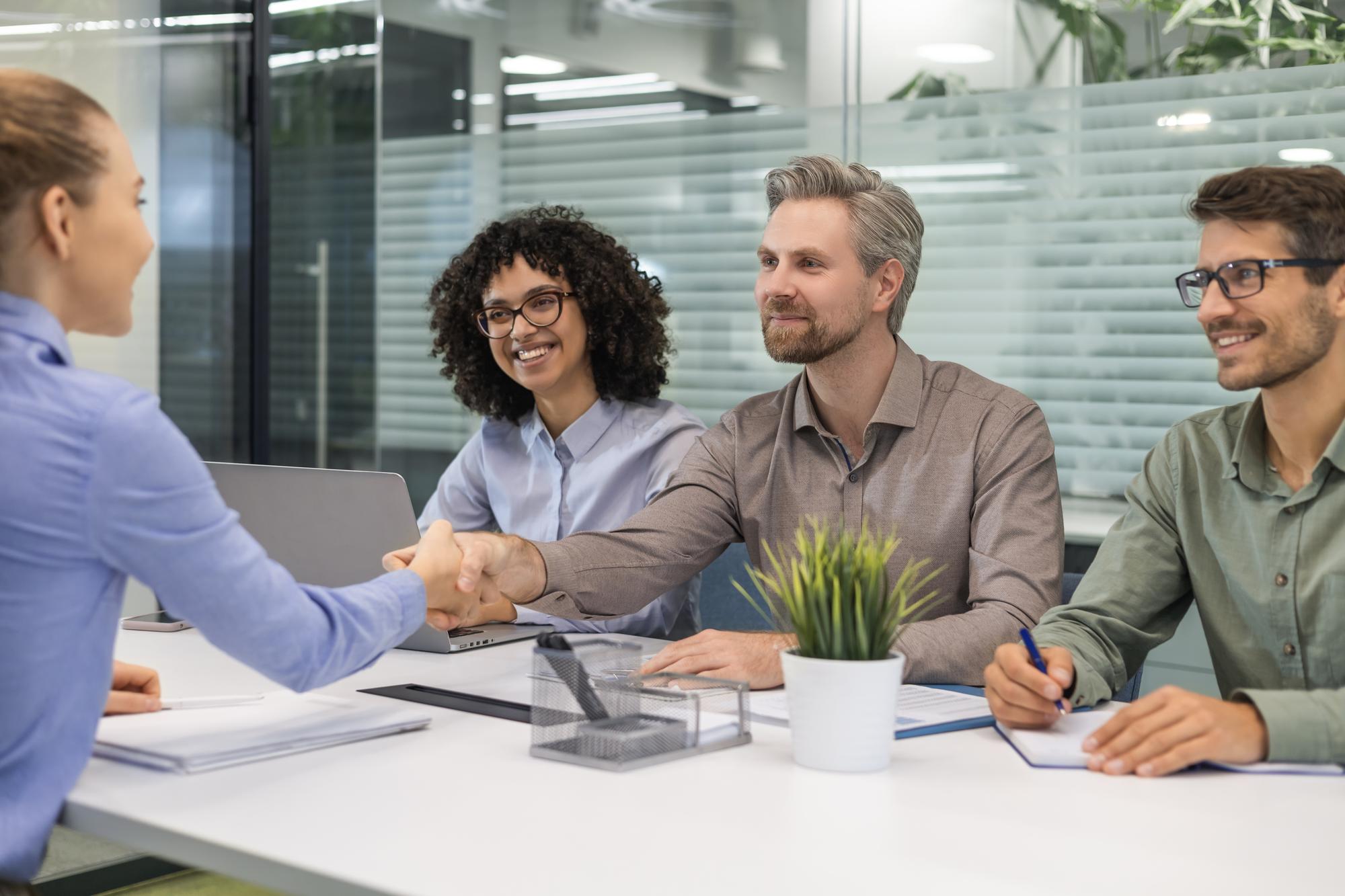 Consultant handshake with client